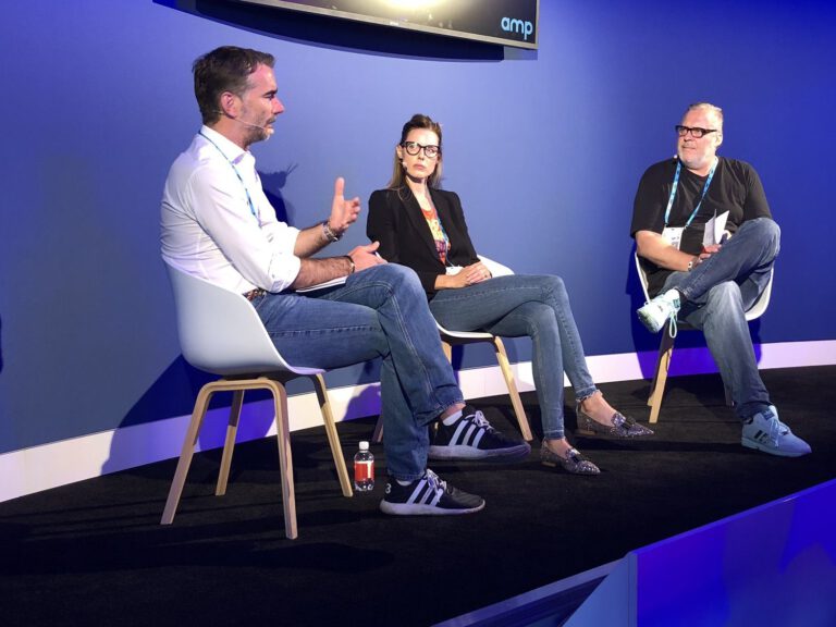 Sandra Cameron taking part in a panel discussion with two fellow speakers.